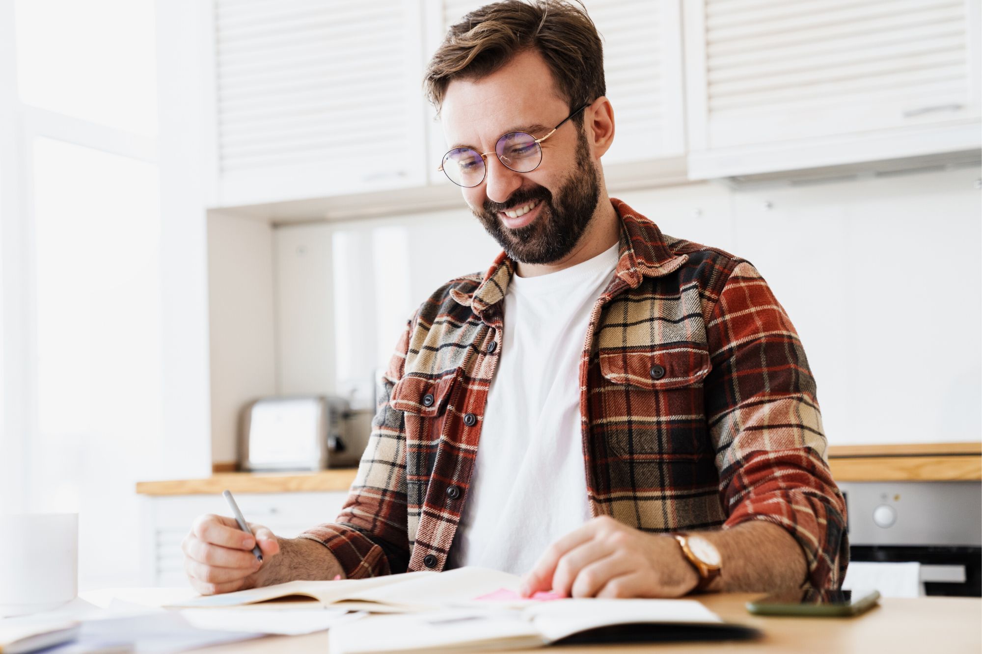 Man writing notes feeling good about himself