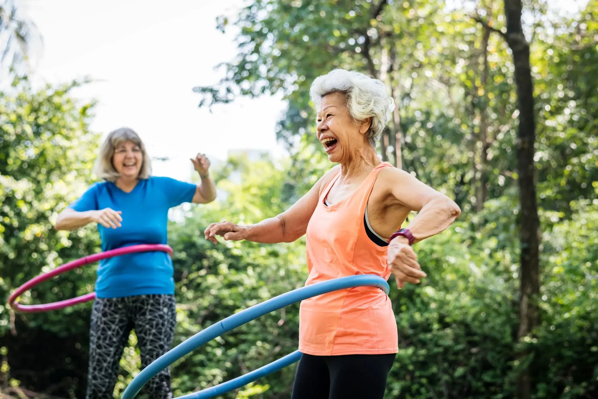A senior woman enjoying a fun, outdoors workout