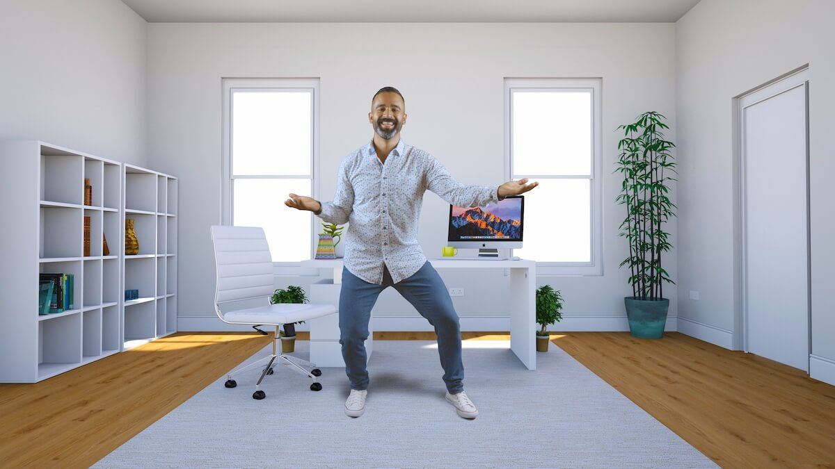 A cheerful man dancing in office with arms wide open
