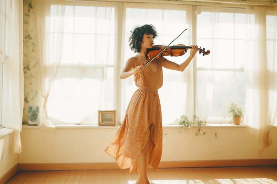 An asian woman playing a fiddle in her 80s styled apartment